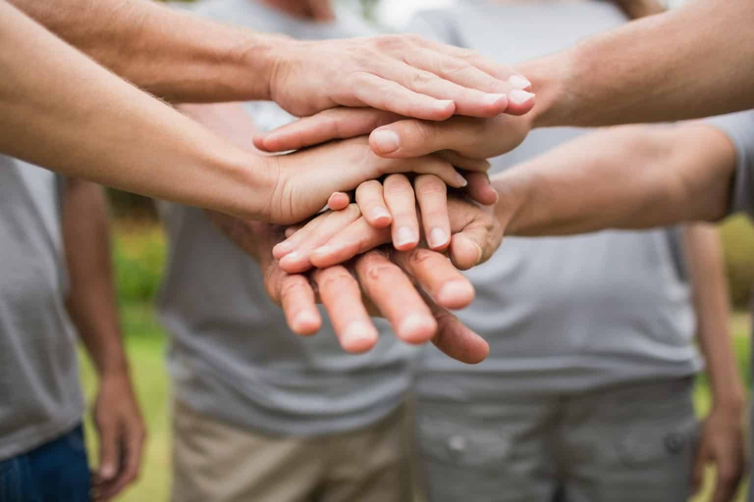 Hands stacked on top of one another