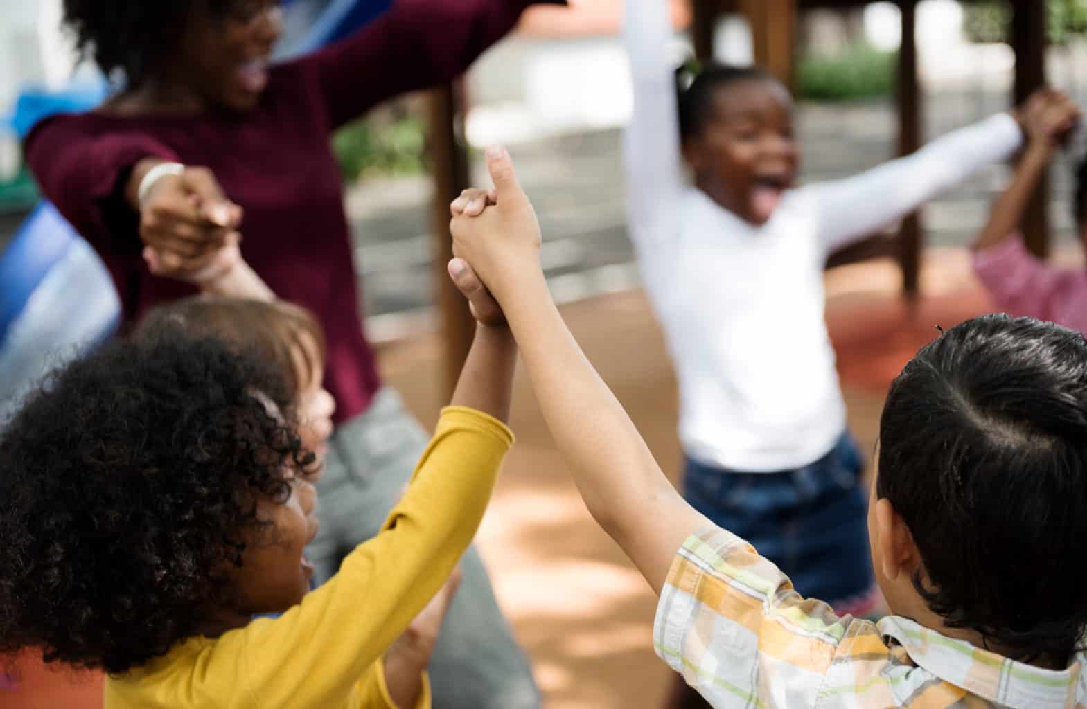 Children holding hands and spinning