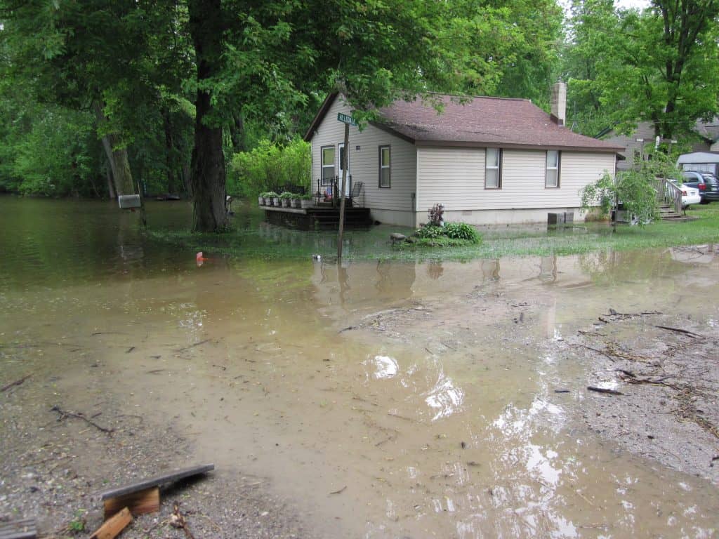 House surrounded by flood waters